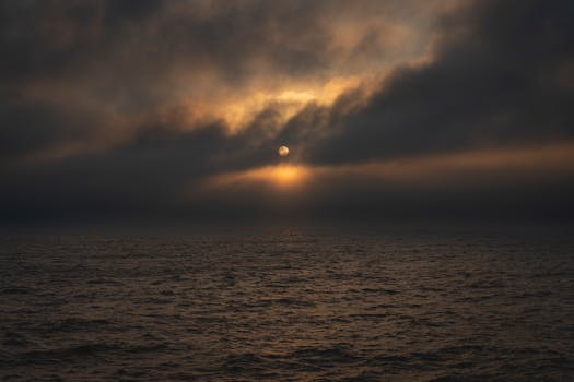 Captivating sunrise over the Atlantic Ocean at Mar del Plata, Argentina, with dramatic clouds.