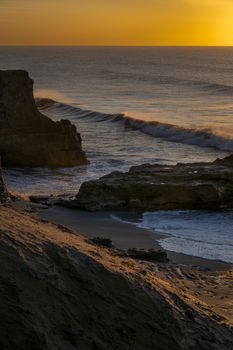 Captivating sunrise over rocky shores at Mar del Plata, Argentina.