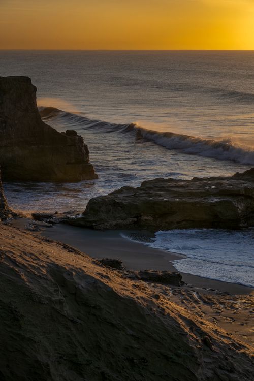 Free Captivating sunrise over rocky shores at Mar del Plata, Argentina. Stock Photo