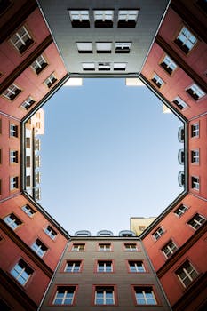 An upward view of symmetrical modern architecture in Berlin, Germany.