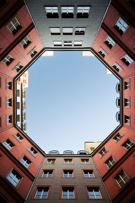 An upward view of symmetrical modern architecture in Berlin, Germany.