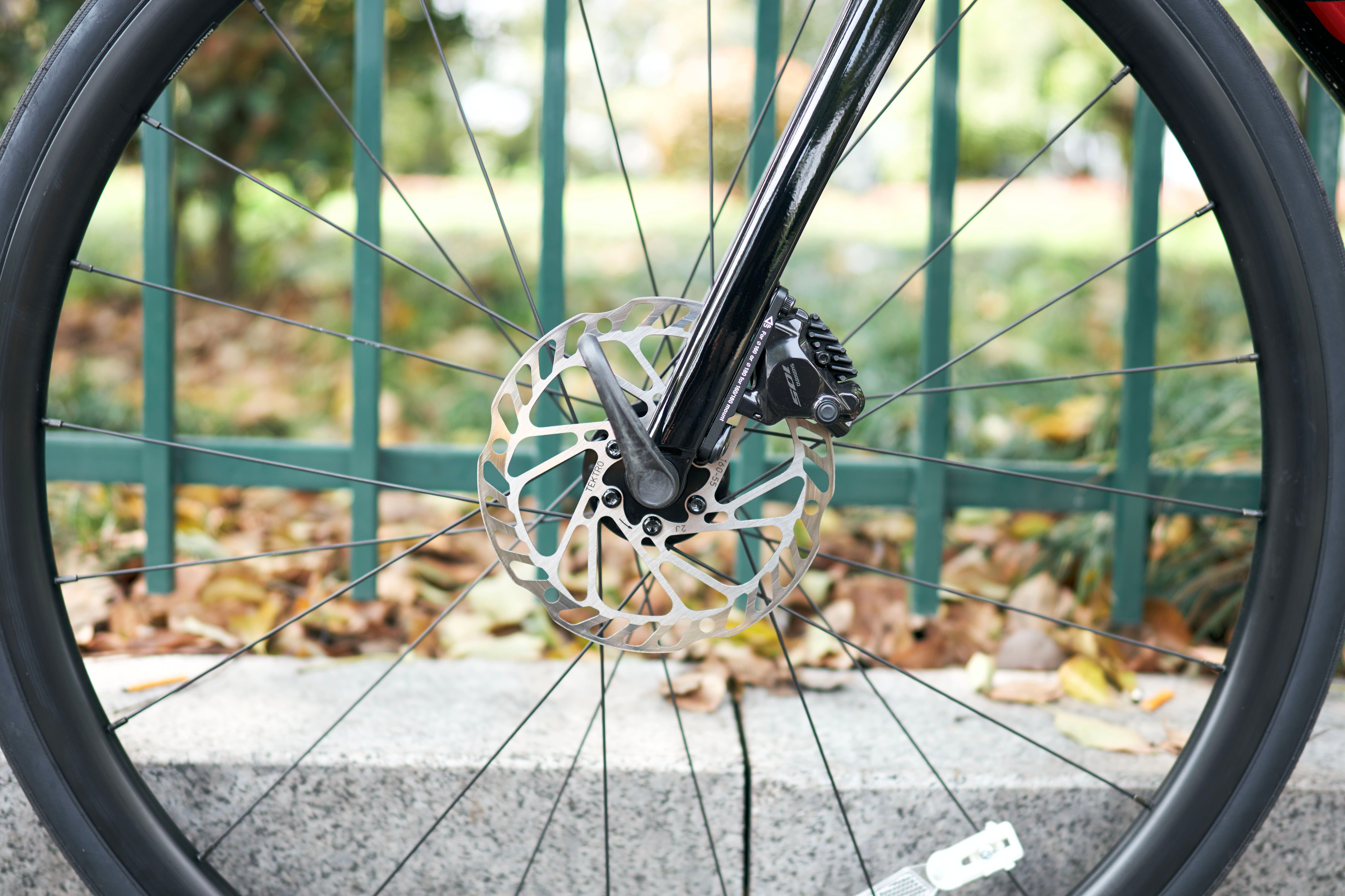 Detailed view of a bicycle wheel featuring a modern disc brake. Ideal for cycling enthusiasts and technology.