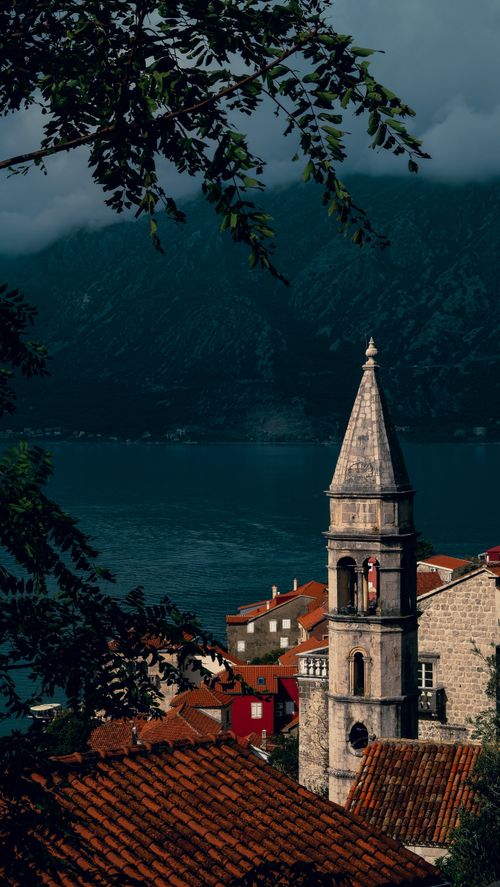 Free Scenic view of a historic bell tower with Kotor Bay in the background, Montenegro. Stock Photo