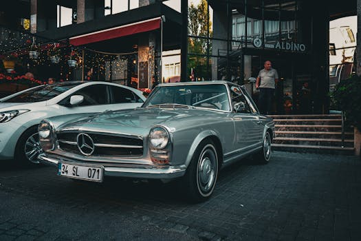 A vintage Mercedes-Benz car parked outside Hotel Aldino in Ankara, Türkiye during the day.