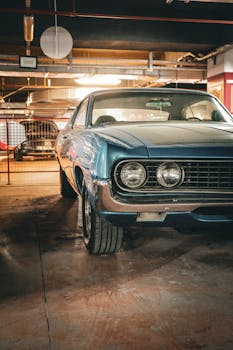 A classic vintage car parked in an indoor garage in Ankara, Türkiye, showcasing retro design.