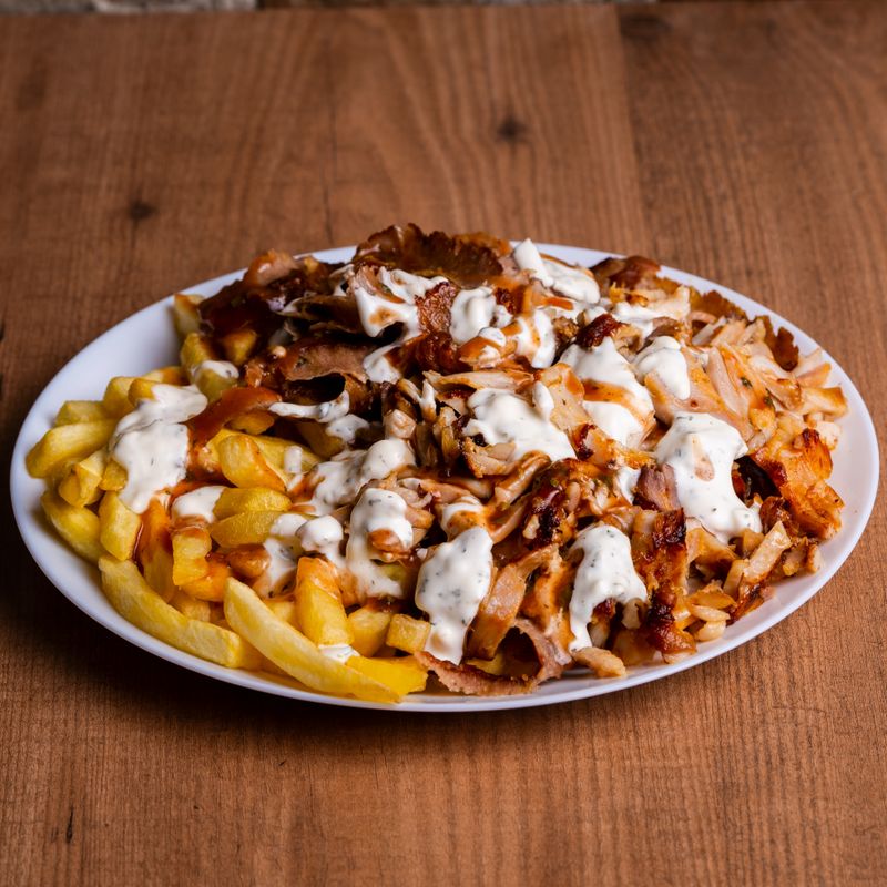 Chicken shawarma plate with fries and sauce