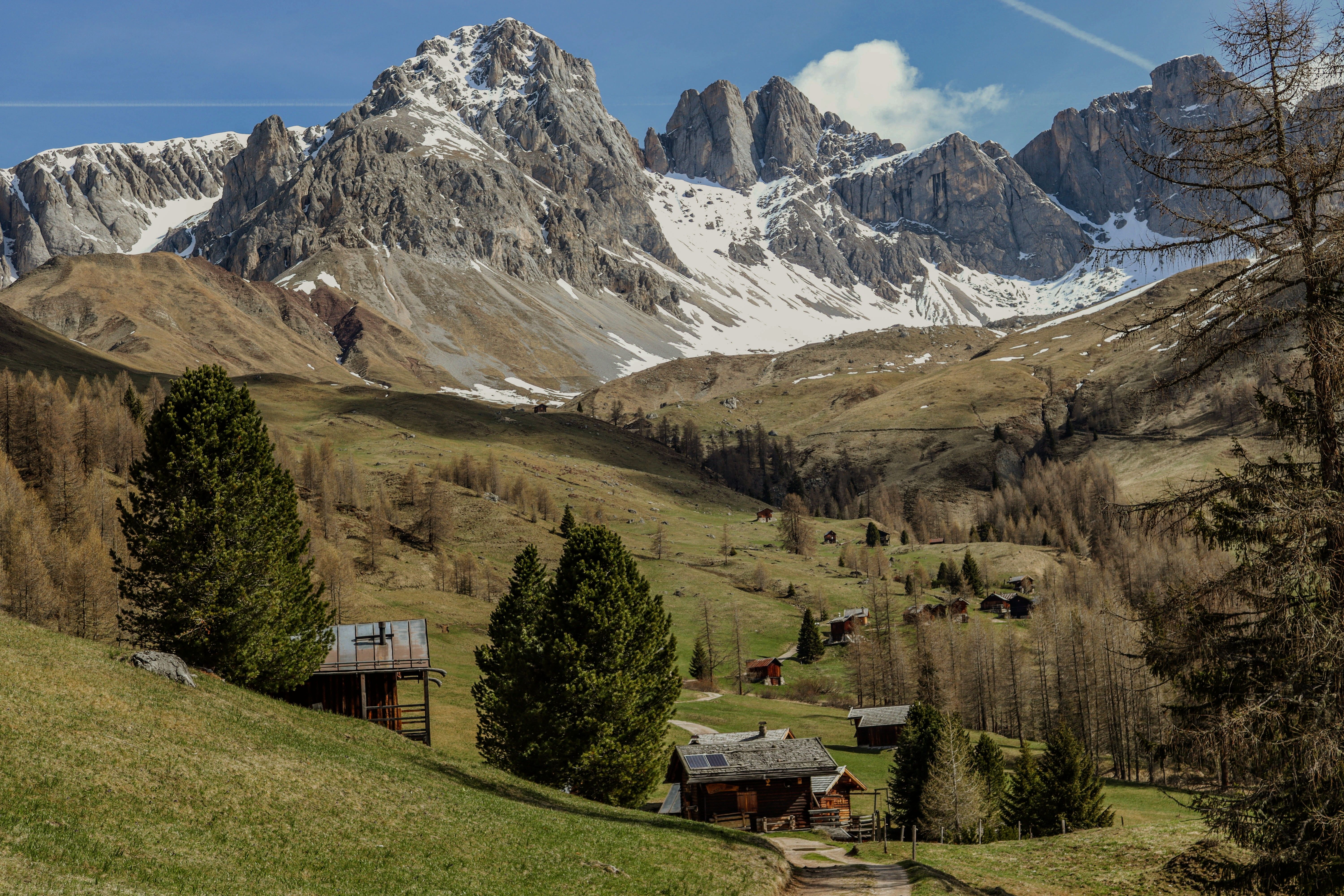 Scenic Mountain Landscape with Rustic Cabins · Free Stock Photo