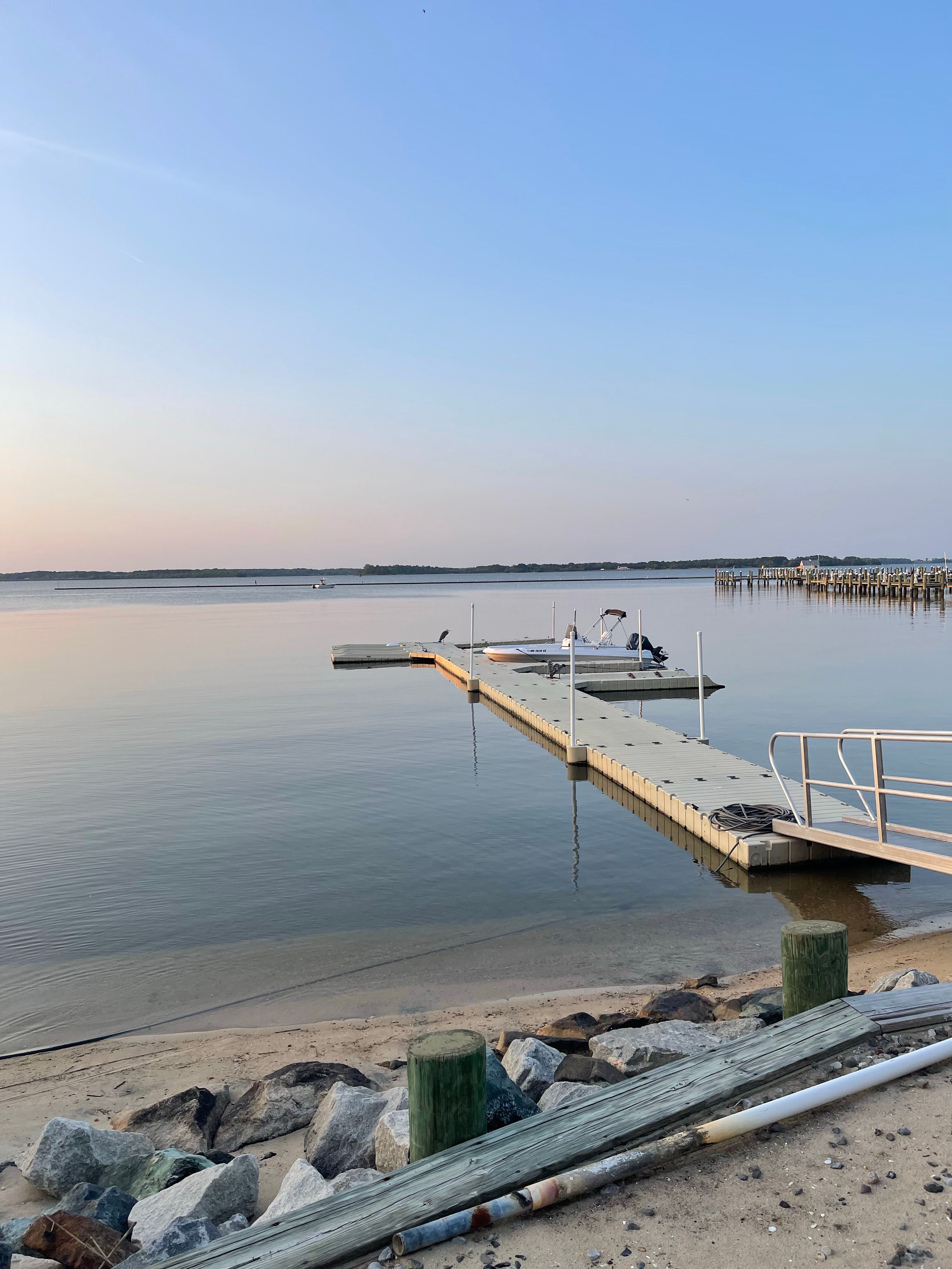 Serene sunset view over docking pier in Cambridge, Maryland.