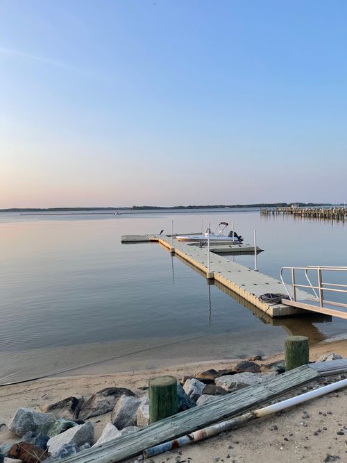 Free Serene sunset view over docking pier in Cambridge, Maryland. Stock Photo