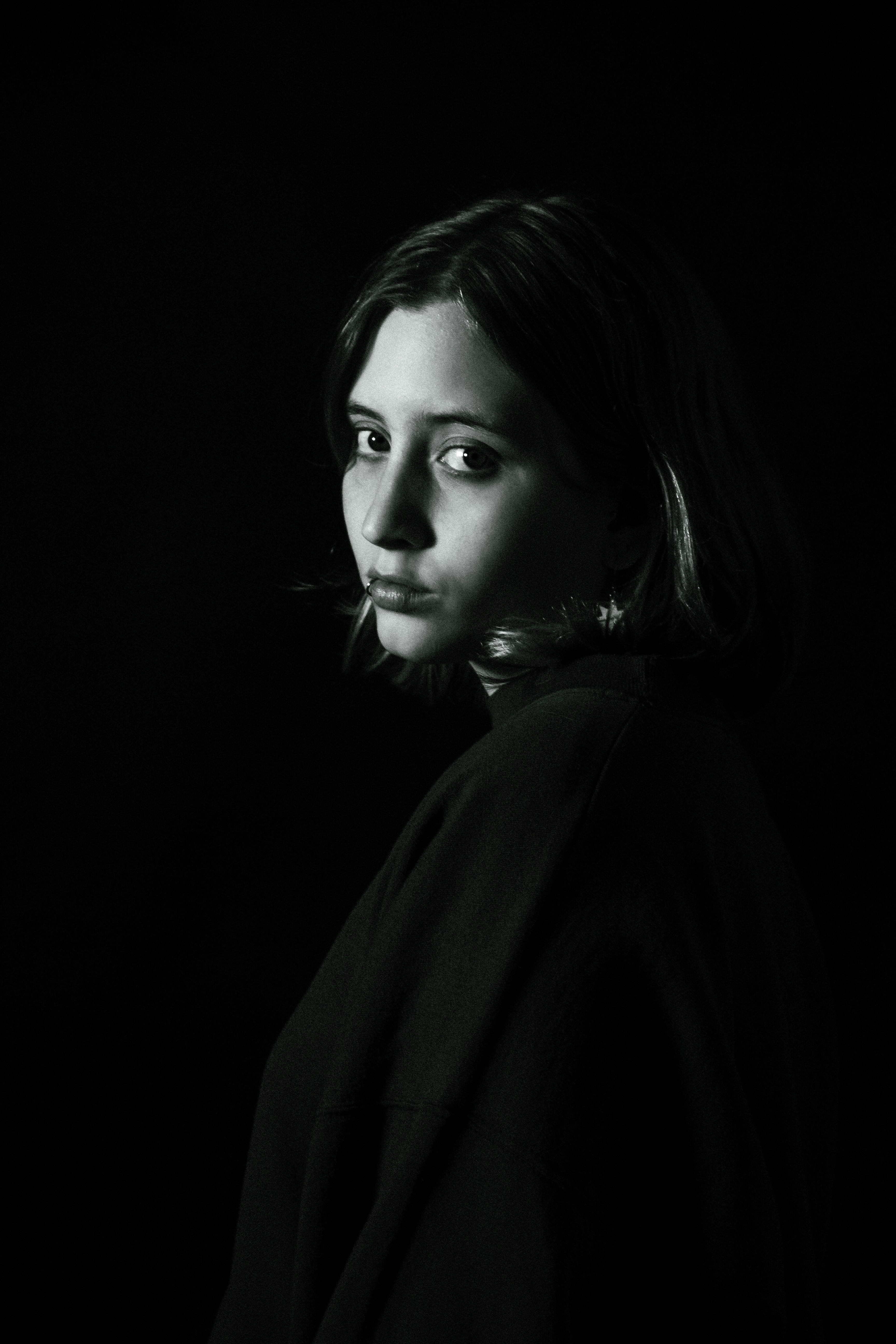 Dramatic Portrait of a Young Woman with Intense Gaze · Free Stock Photo