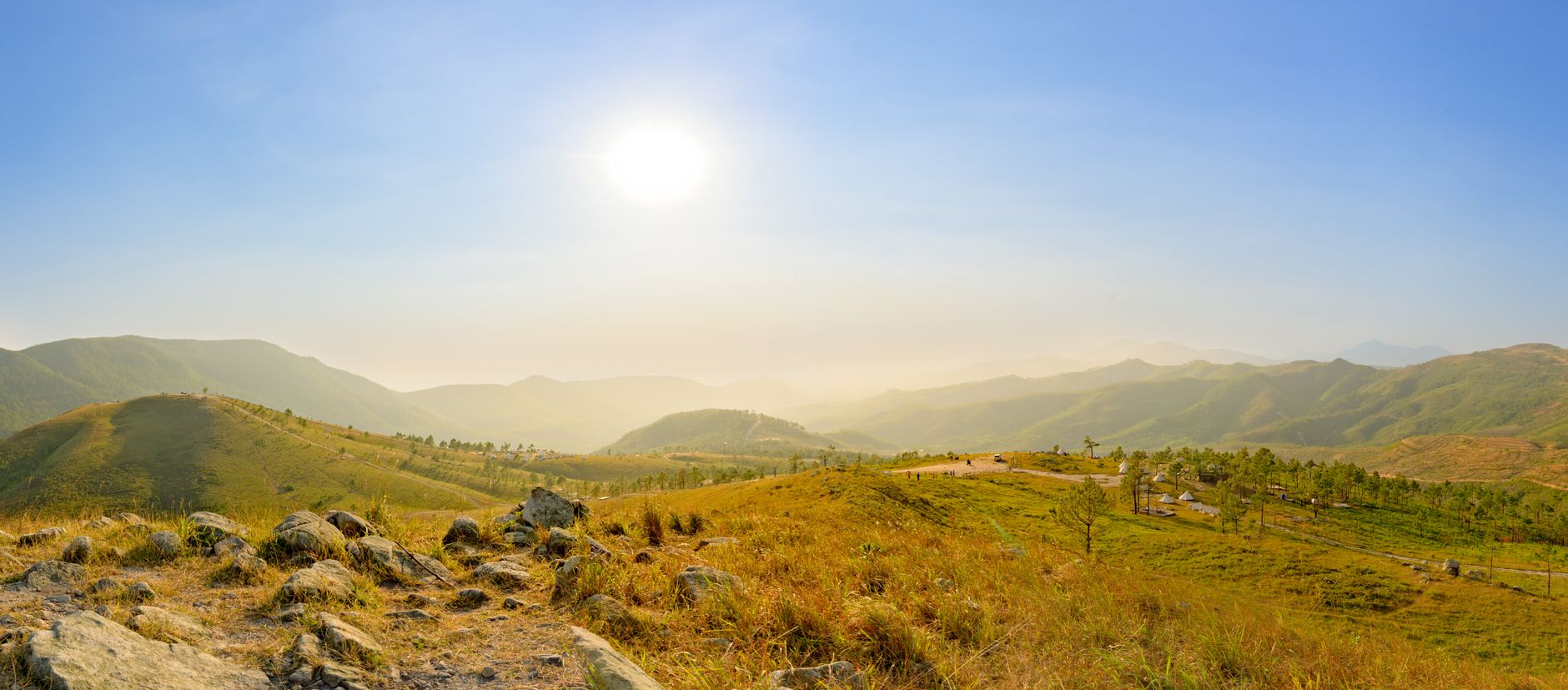 Stunning landscape view of golden hills under a bright sky in Thành phố Uông Bí, Vietnam.