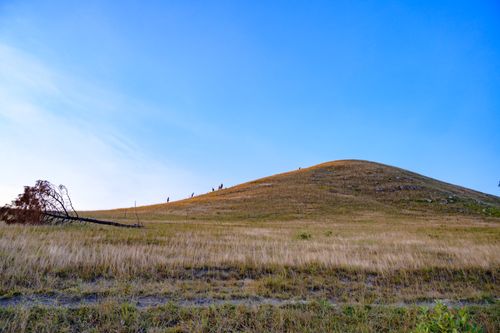Free Expansive hillside in Uông Bí, Quảng Ninh, under a clear blue sky. Stock Photo