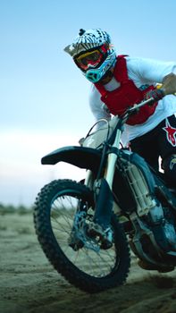 Experience adrenaline-fueled motocross in the vast Kuwait desert landscape.
