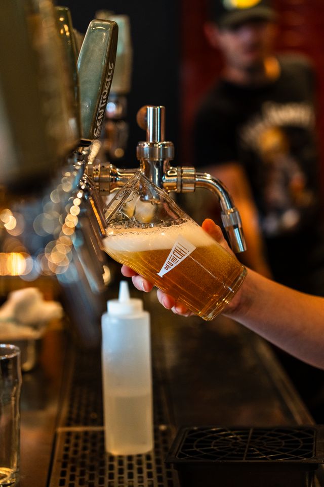 Fresh beer pouring from the tap after a packaging run