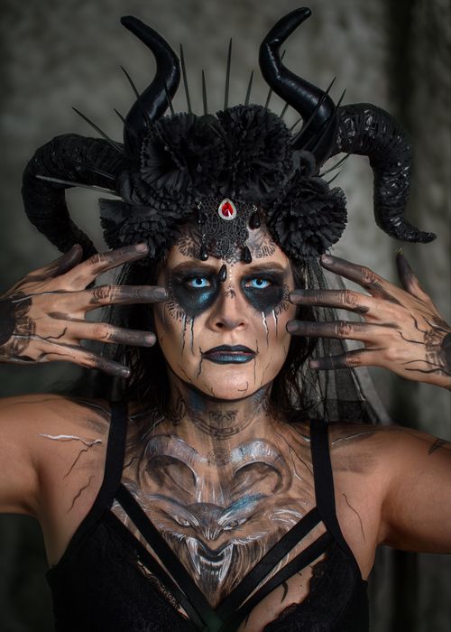 Free A gothic costume portrait with elaborate antlers and dark makeup, evoking a fantasy theme. Stock Photo
