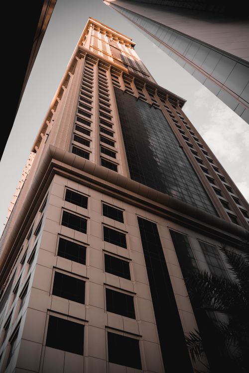 Free Stunning view of a Dubai skyscraper from a low angle emphasizing modern architecture. Stock Photo