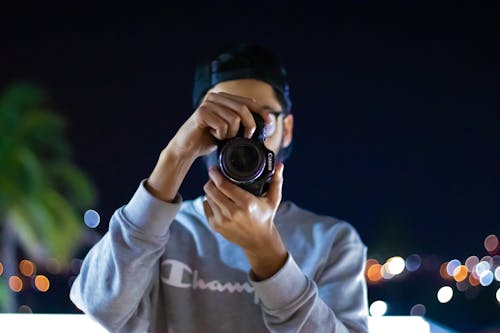 Photo of Person Holding a Camera