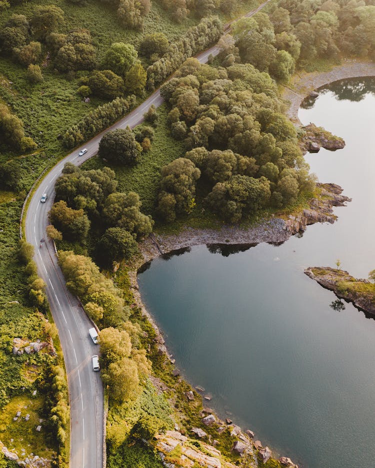 Aerial Photography Of Roadway And Body Of Water