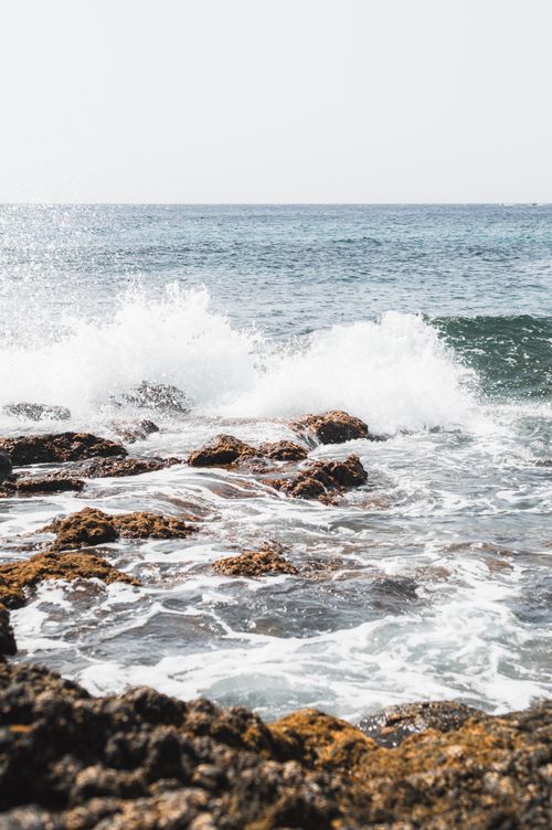Free Dynamic waves crash against rocky shores in Lanzarote, capturing nature's raw beauty. Stock Photo