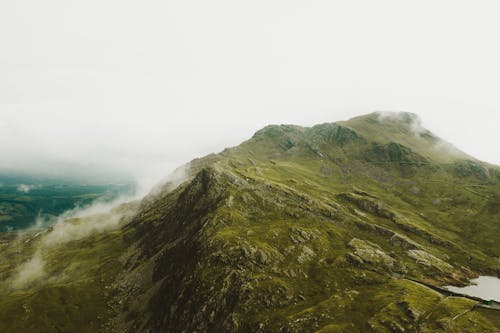 Green Mountain Under Gray Sky