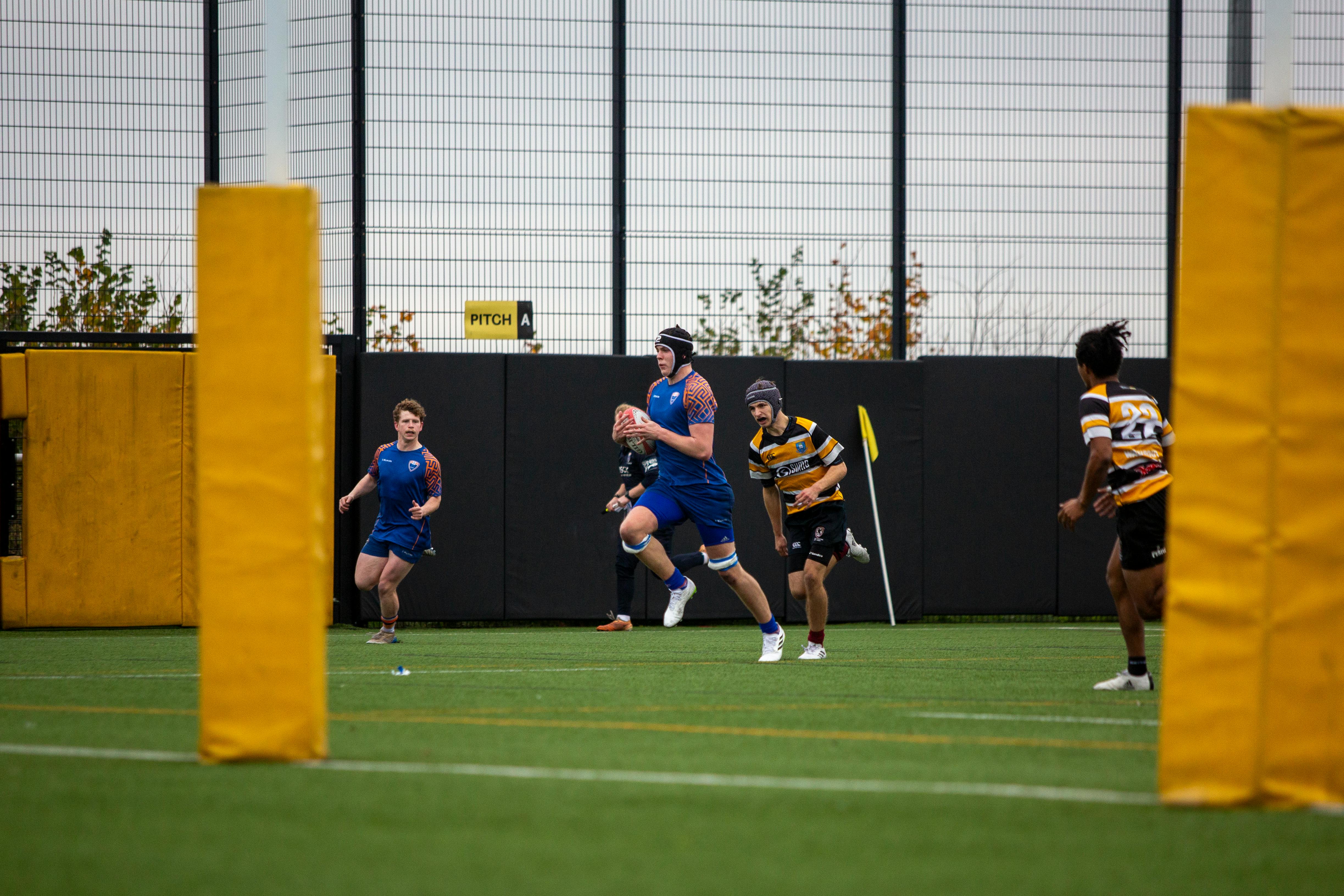 Dynamic Rugby Match on University Field · Free Stock Photo