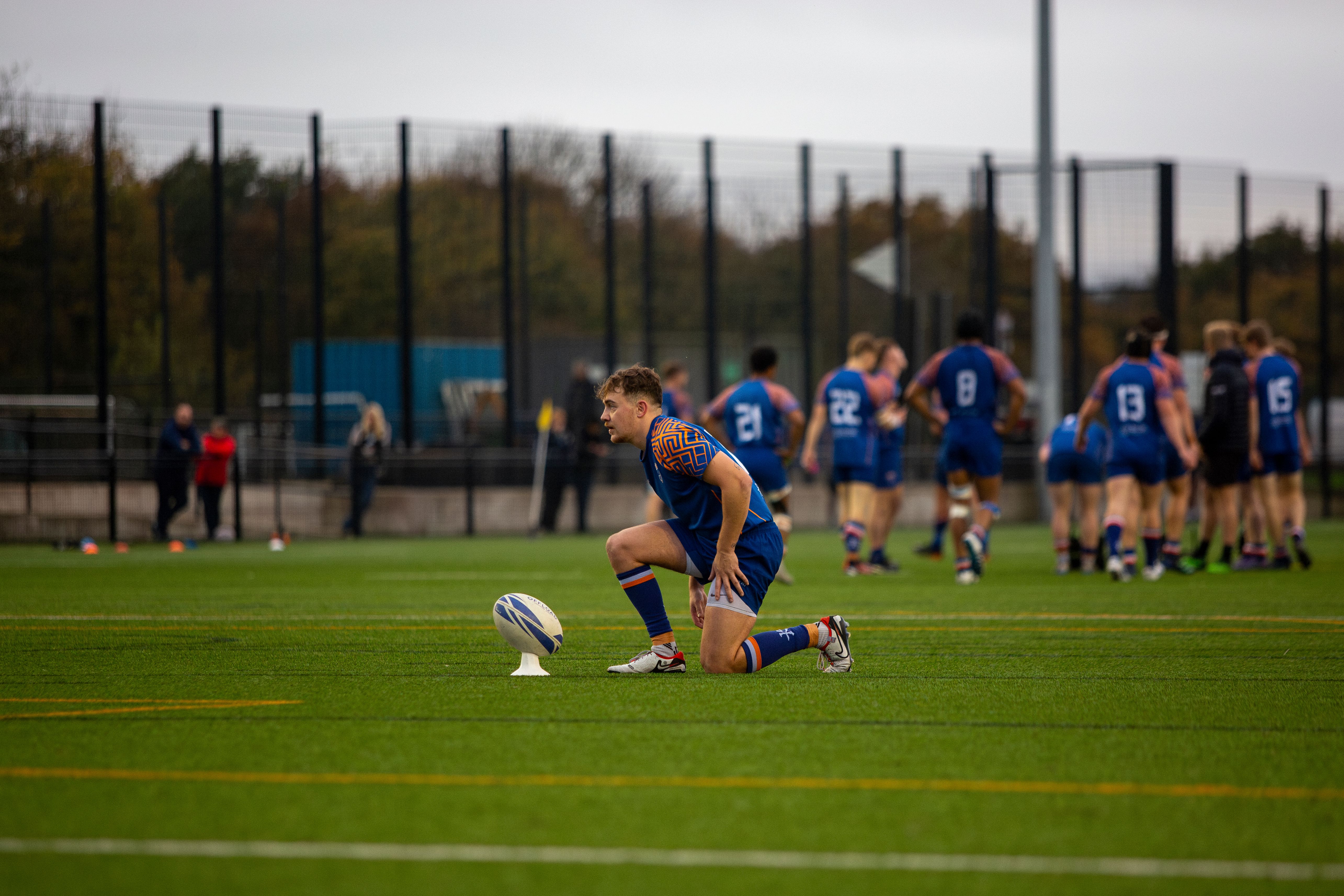 Rugby Player Preparing for a Kick on the Field · Free Stock Photo