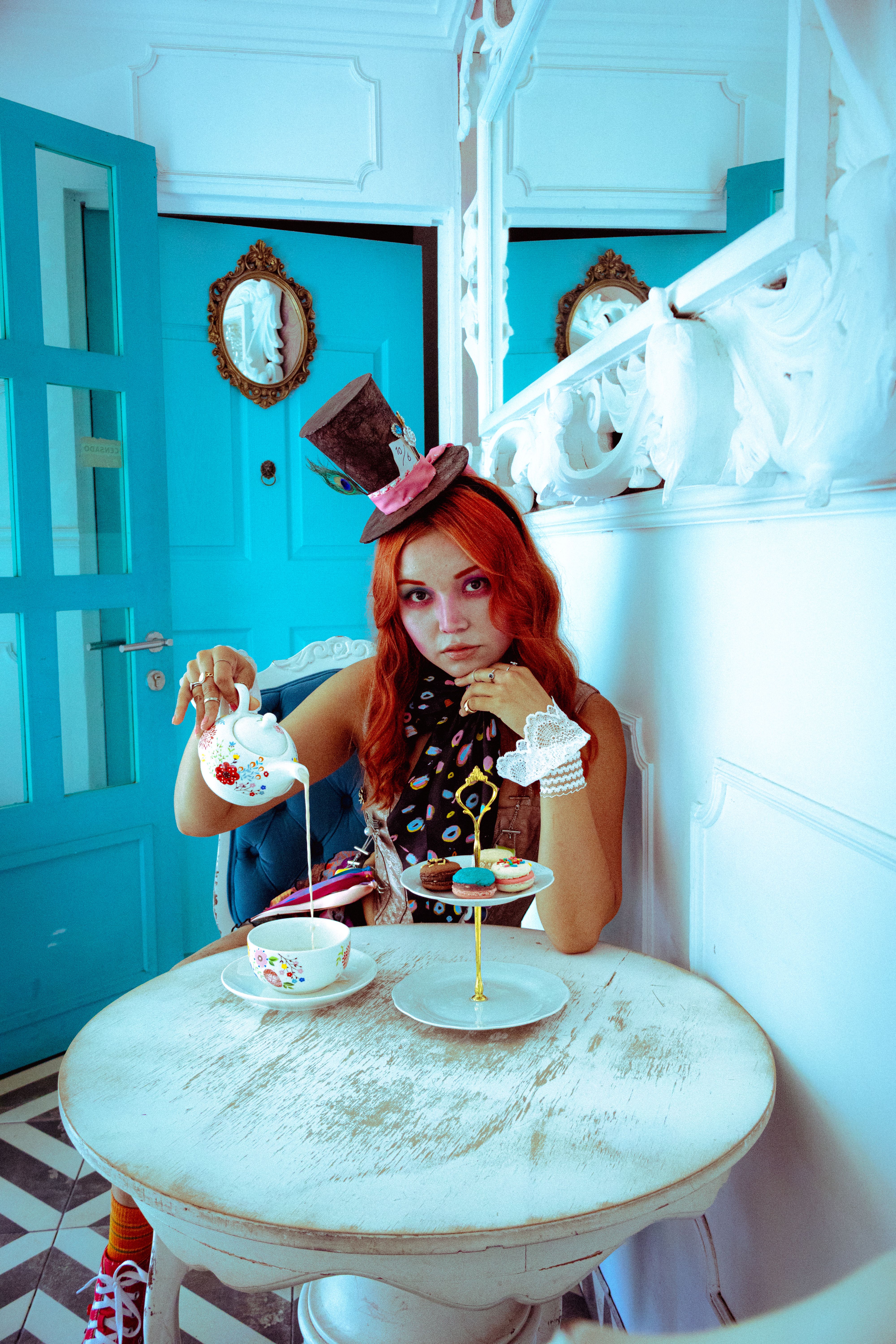 A whimsical Mad Hatter themed tea party scene with vibrant colors and playful decor.