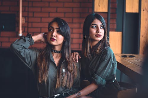 Women Sitting While Looking Away