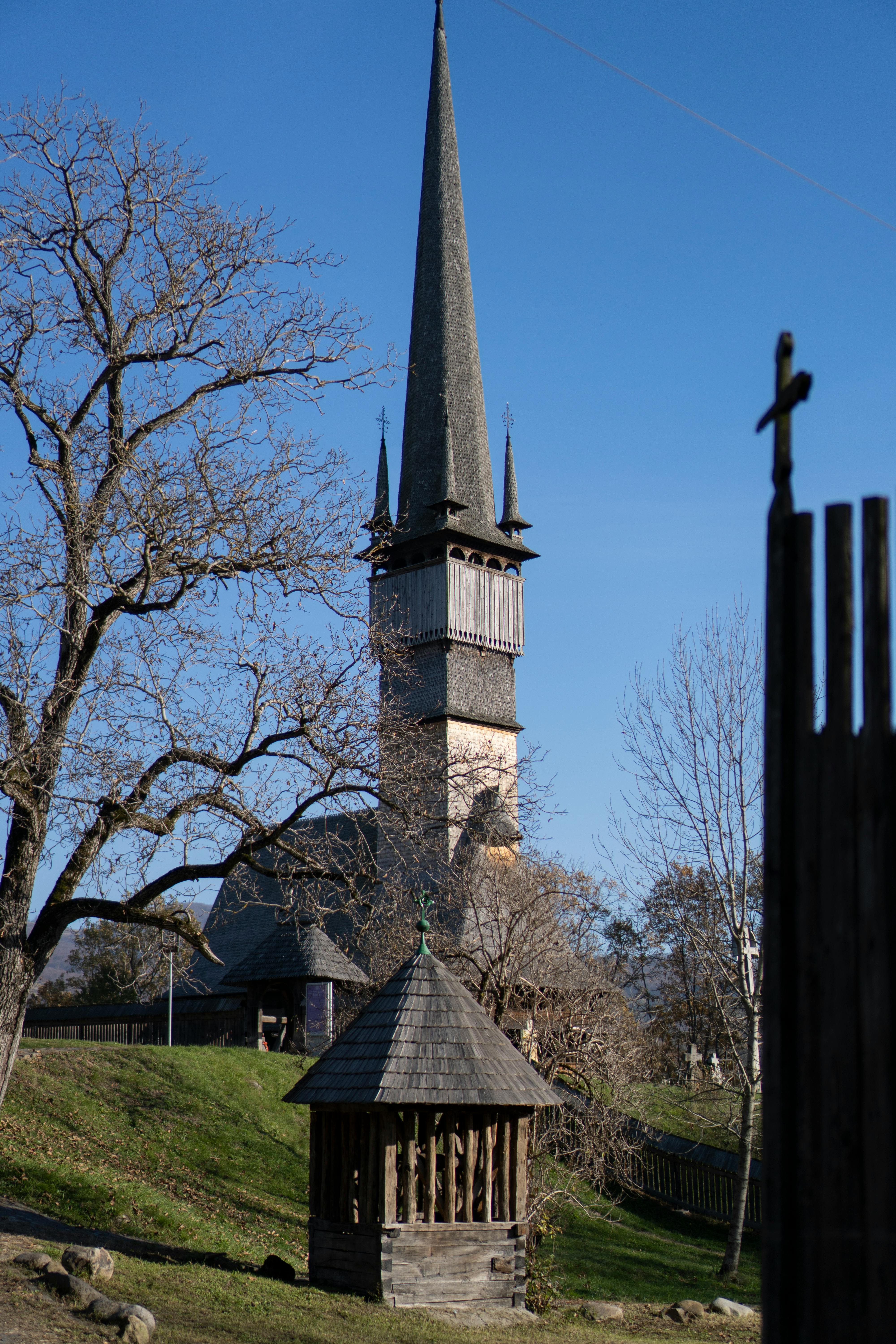 Explore the traditional wooden church in Surdesti, Romania, showcasing rich cultural heritage.