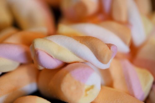 Free Close-up of colorful twisted marshmallow candies, perfect for sweet cravings. Stock Photo