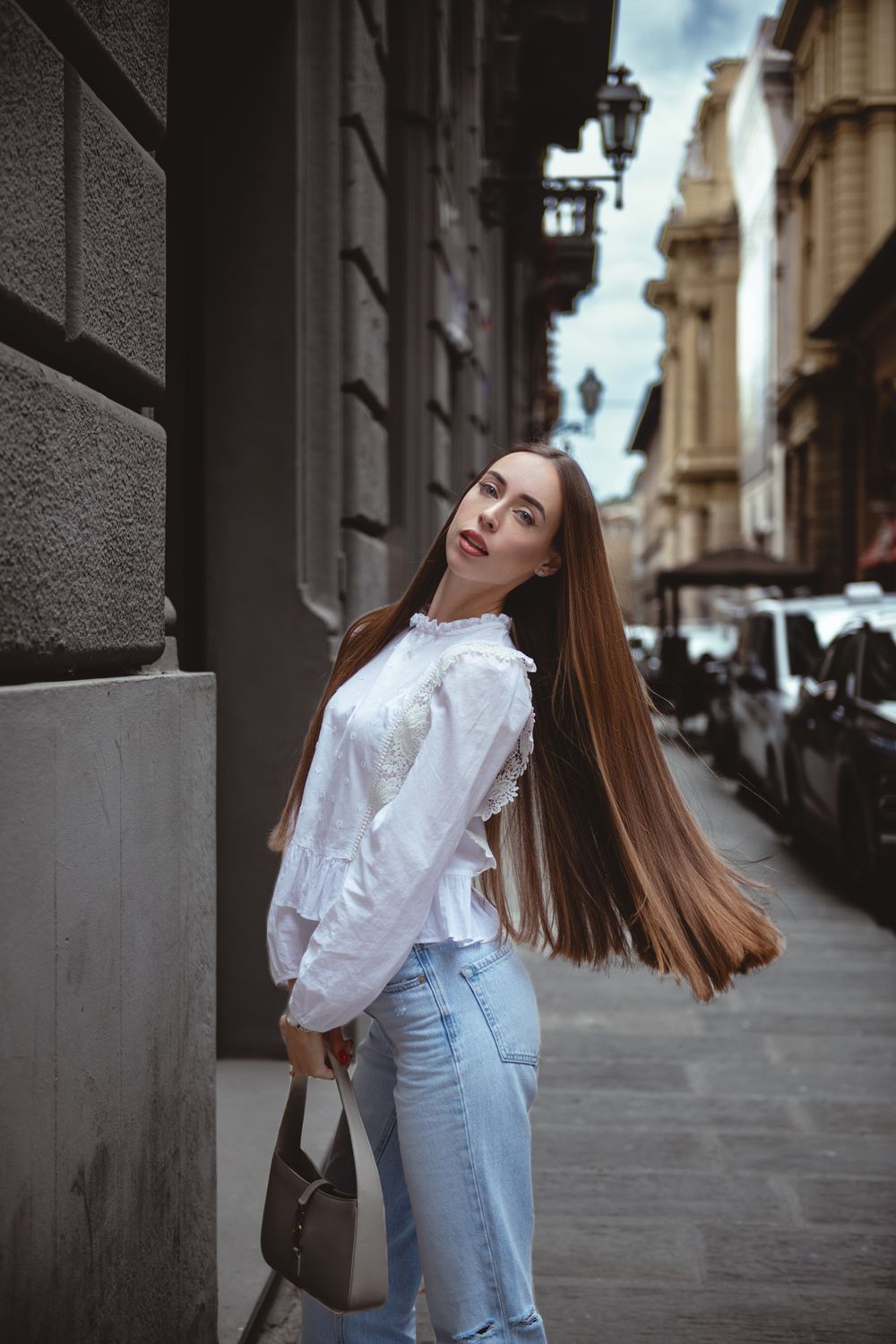 Elegant Woman with Long Hair on Florence Street · Free Stock Photo