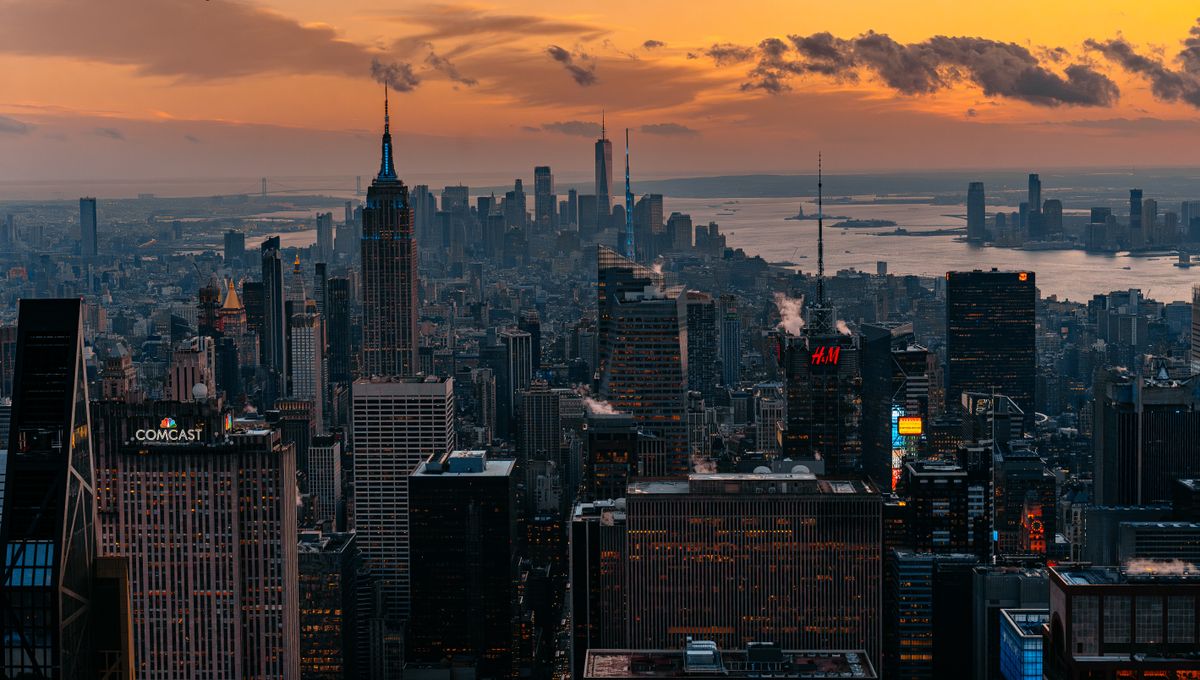 New York City skyline at sunset seen from the water — Long Island to NYC limo service