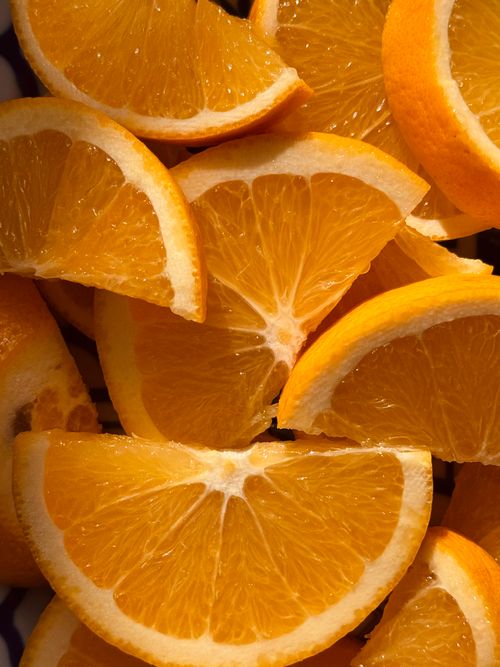 Free Fresh orange slices creating a vibrant and juicy composition. Stock Photo