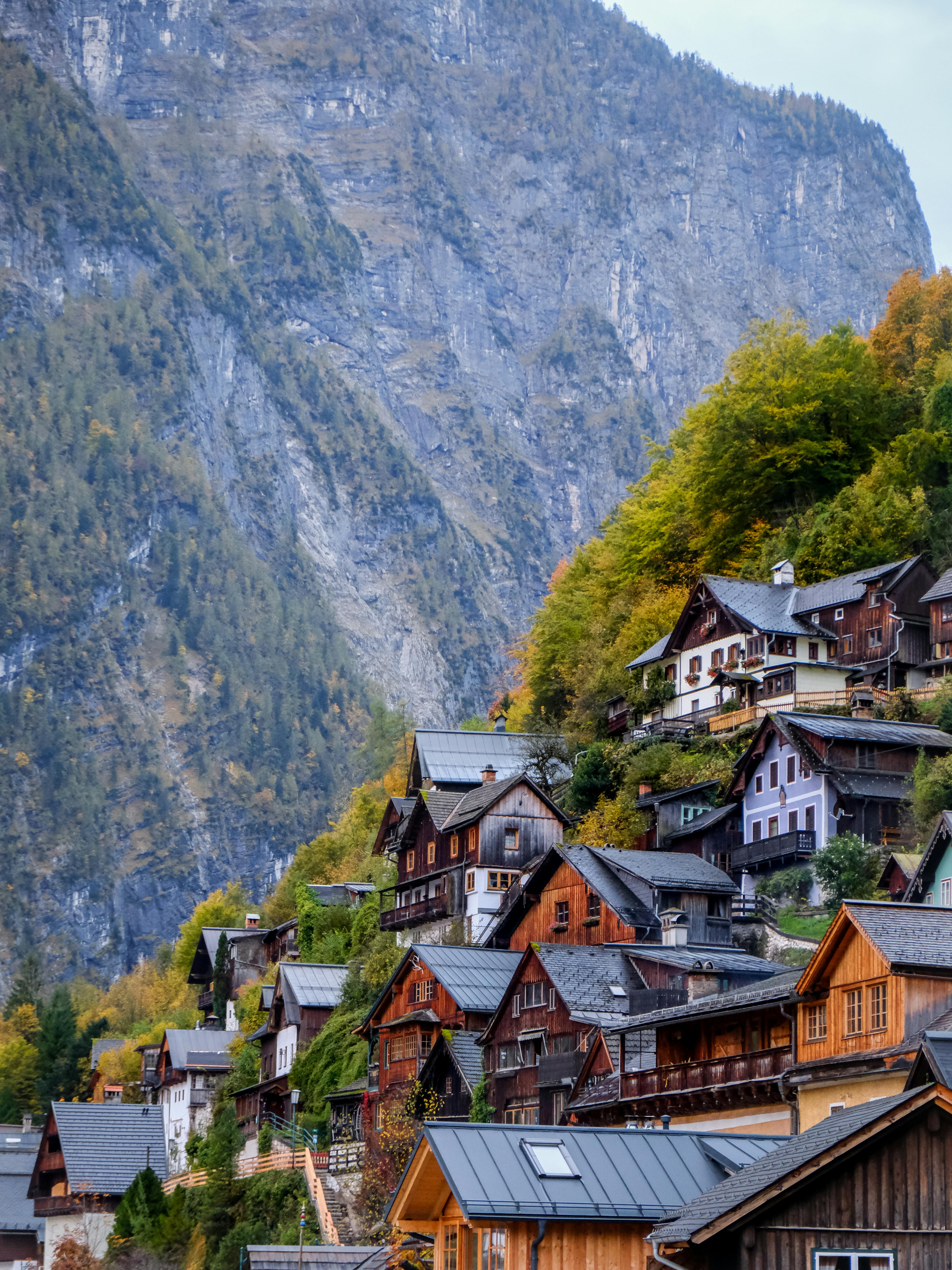 Picturesque view of Hallstatt's traditional wooden houses nestled in the Alps during autumn.