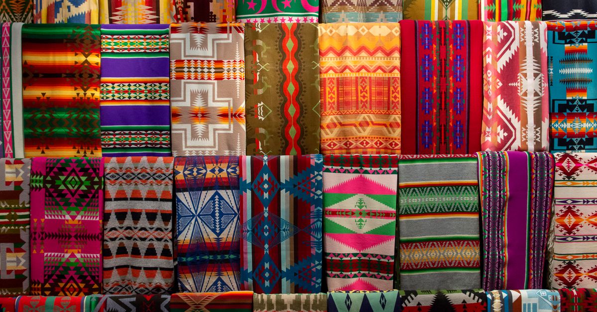 Colorful Textiles with Geometric Patterns Displayed · Free Stock Photo