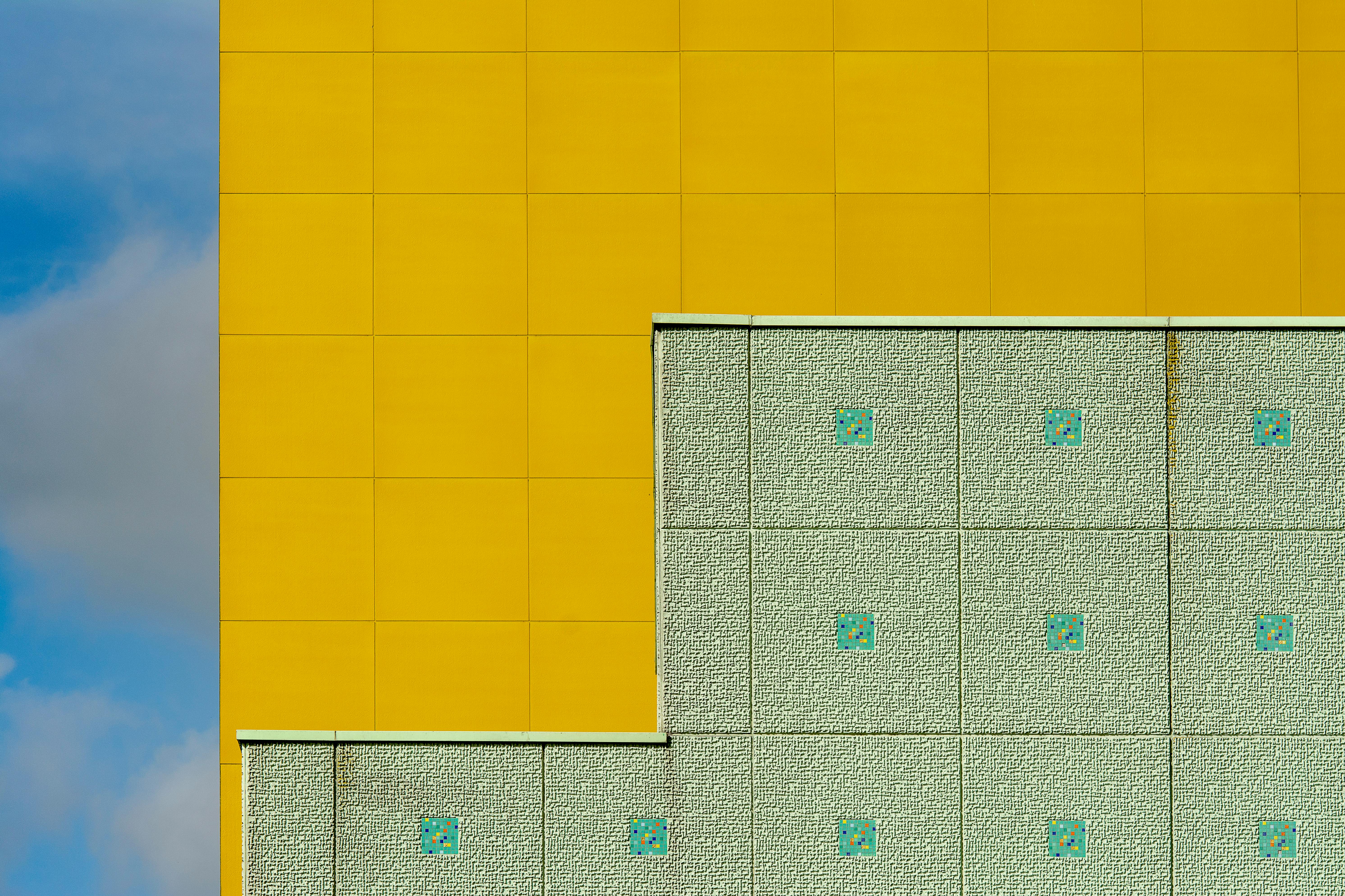 vivid yellow and green building facade