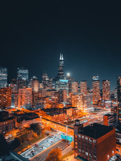 Free Breathtaking aerial view of Chicago's illuminated skyline at night. Stock Photo