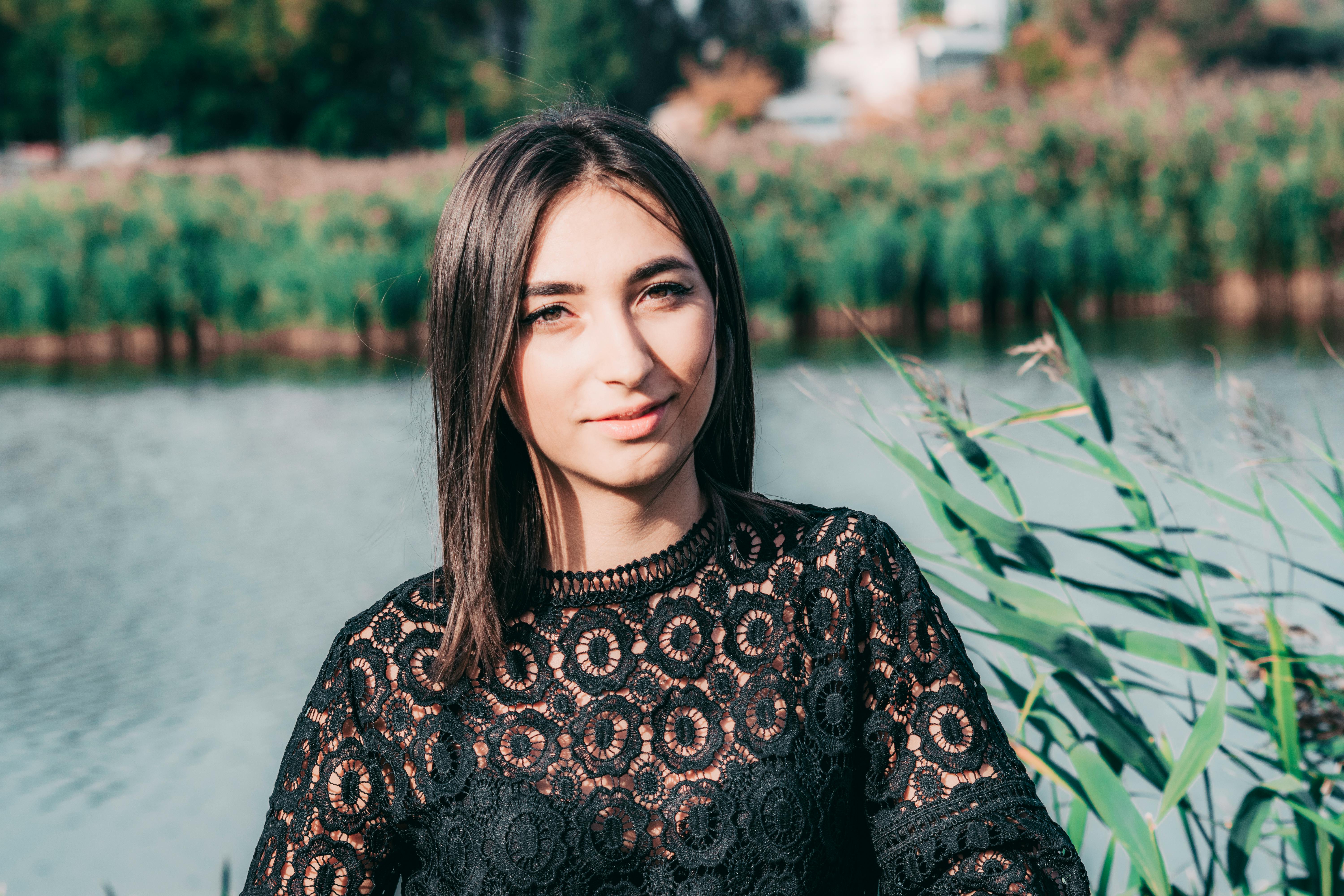 Woman Wearing Black Lace Top