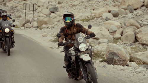Free Motorcyclists in protective gear navigating a rocky road on their adventure. Stock Photo