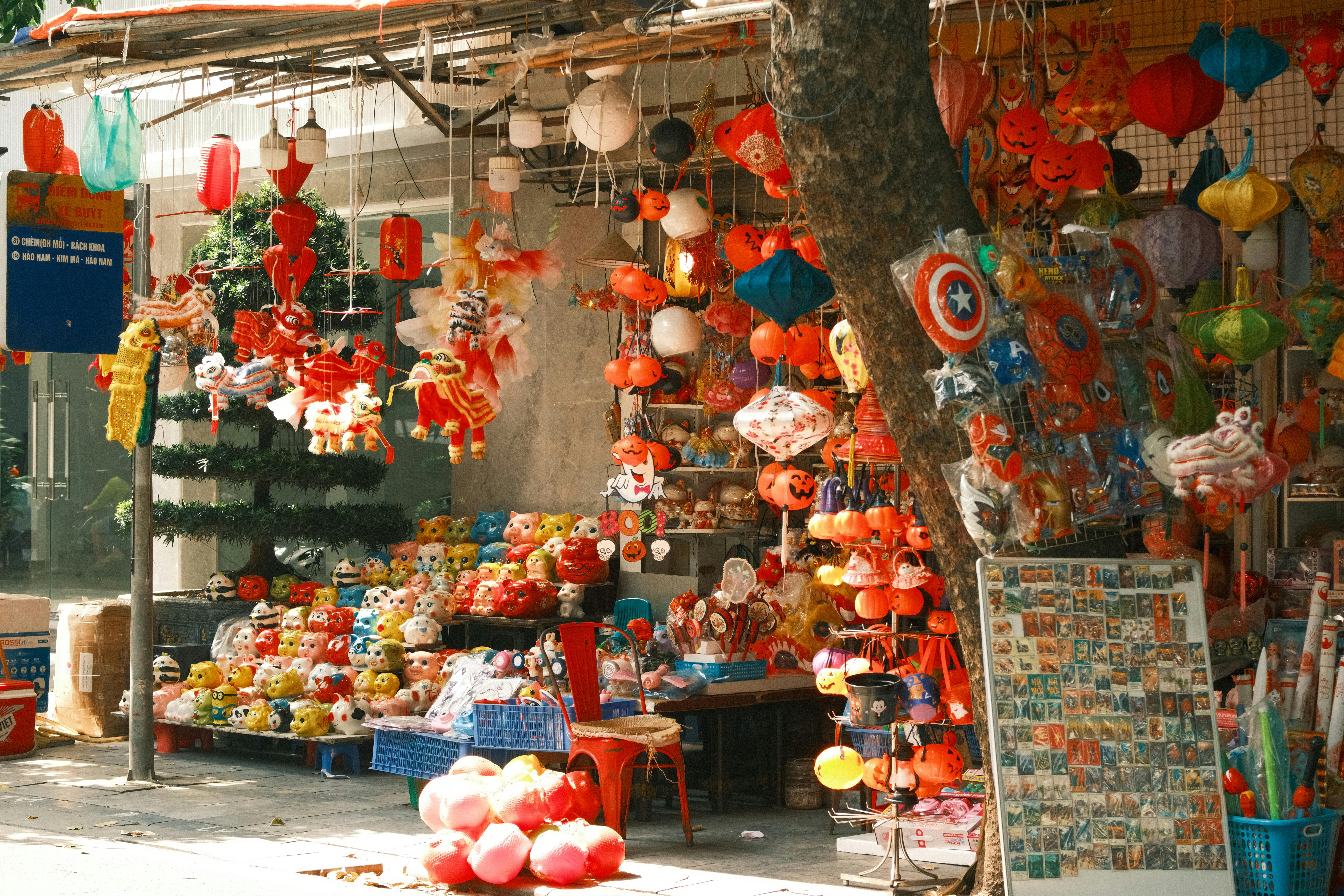 Free A vibrant display of traditional lanterns and toys at a Hanoi market, capturing the essence of Vietnamese culture. Stock Photo