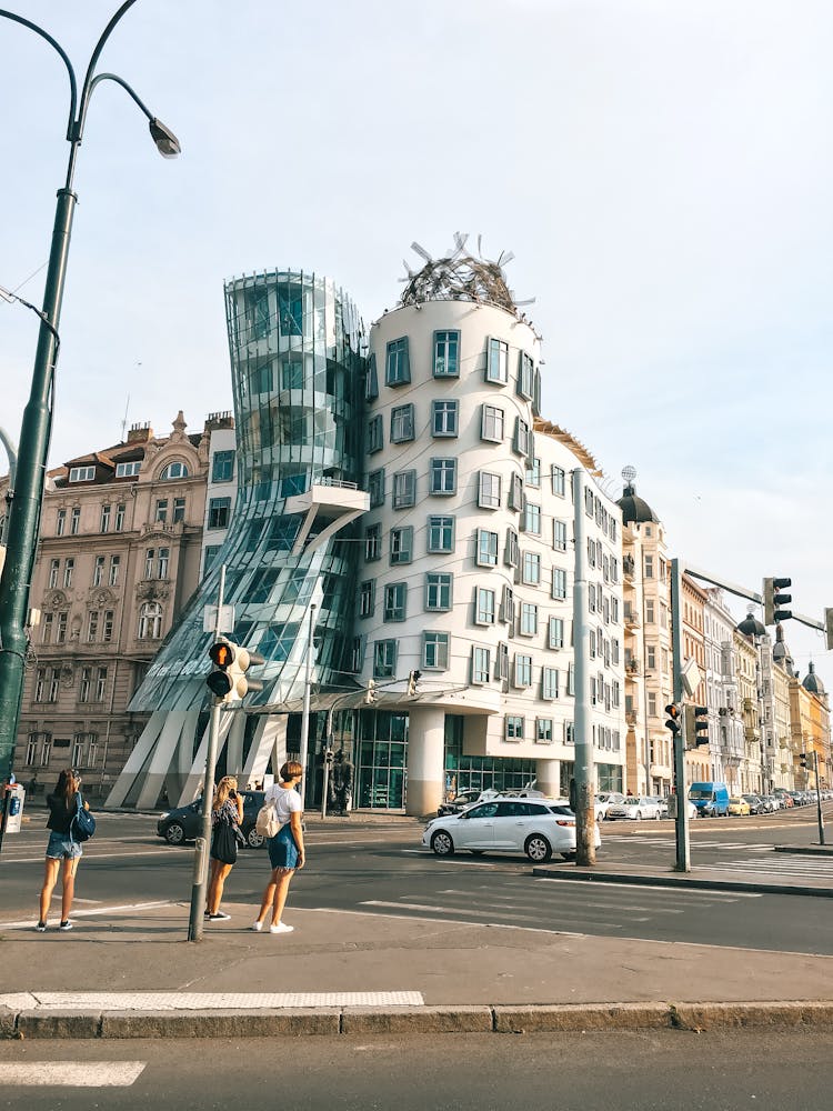 Group Of People Standing In Front Of Building