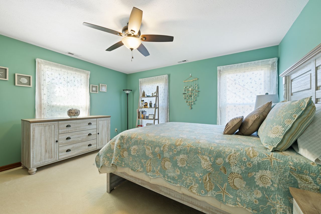 coastal-bedroom Beach-themed bedroom with aqua decor and ceiling fan