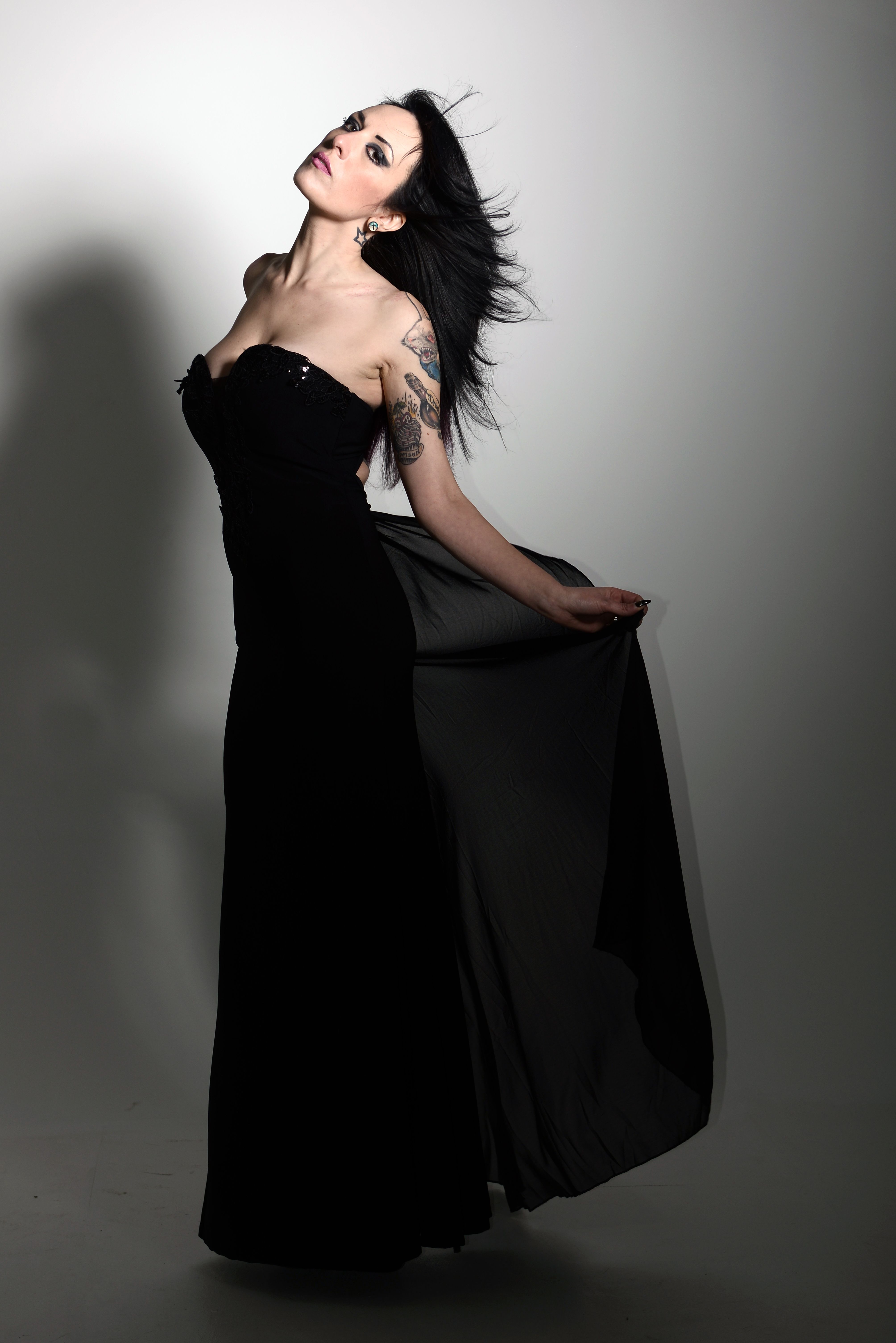 Elegant Woman in Black Dress Studio Portrait · Free Stock Photo