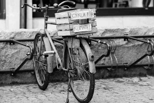 Black and white photo of a vintage bike in Jönköping with a climate message.