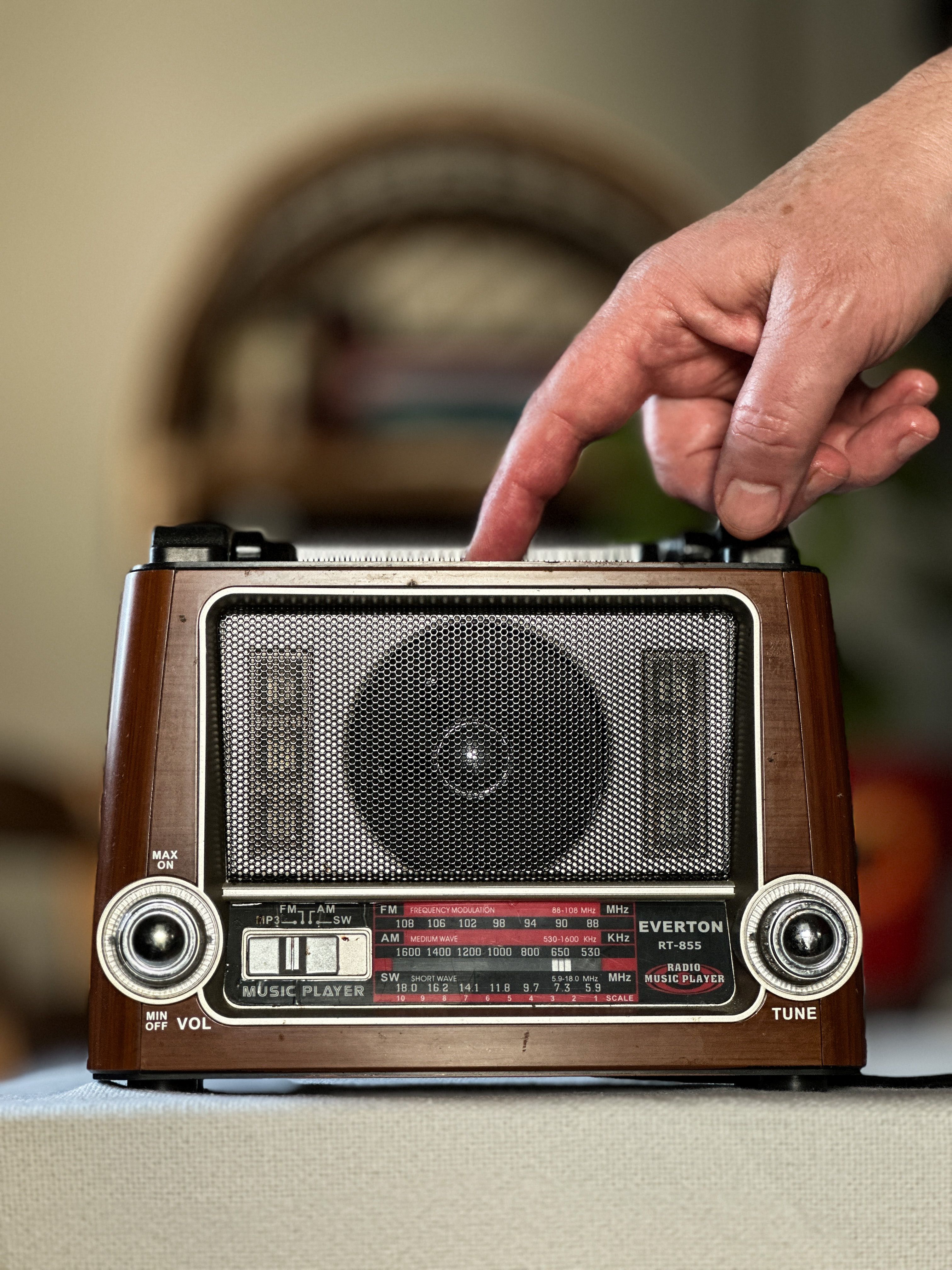 Vintage Radio Being Used at Home Interior · Free Stock Photo