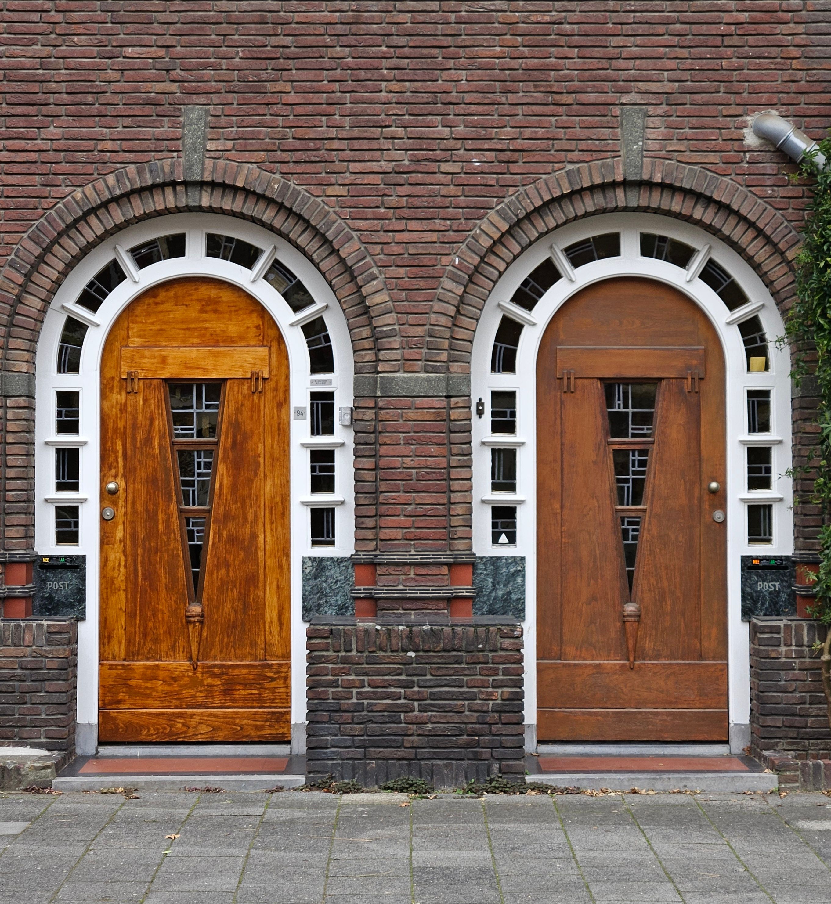 Capture of classic wooden doorways with arch design in Eindhoven, Netherlands.