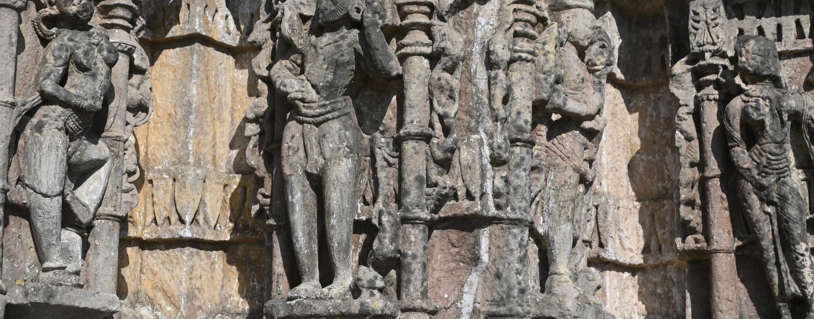 Detailed stone carvings on an ancient temple facade showcasing historical artistry.