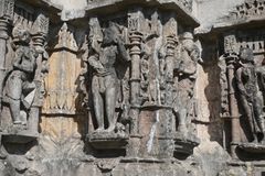 Detailed stone carvings on an ancient temple facade showcasing historical artistry.