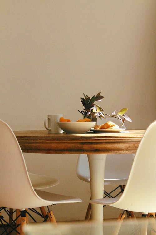 Free Croissant Bread Beside Bowl and Mug on Table Stock Photo