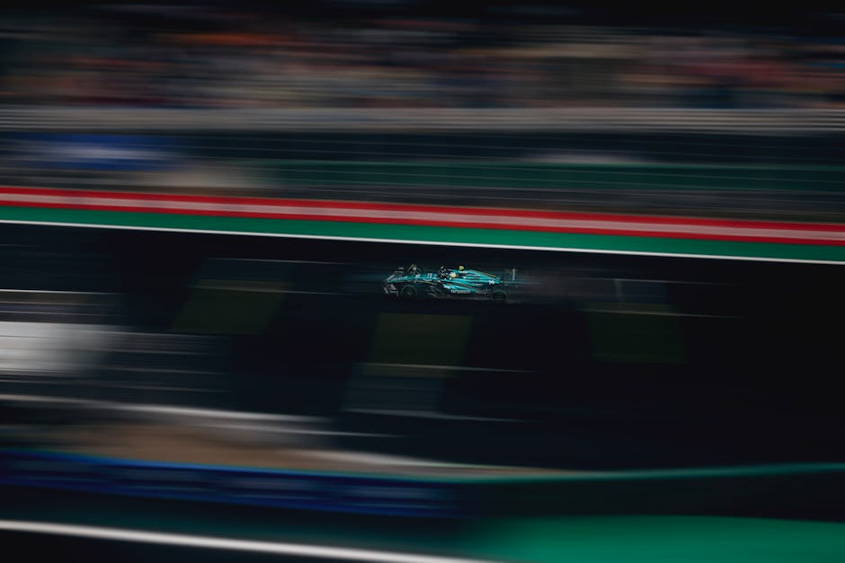 Blurred motion of a racing car speeding on a track during a competitive race